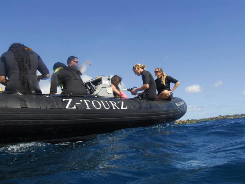 13668916_1117235891647993_4347828175499249067_o1 snorkelers sitting on side of inflatable snorkeling boat