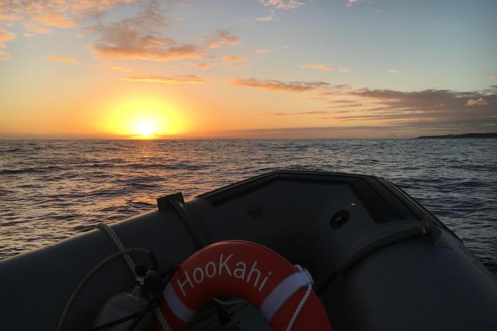 a sunset over a body of water